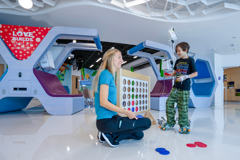 Child life Specialist with patient at Child Life Zone